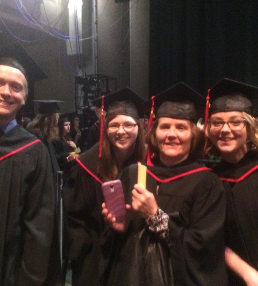 picture of red river graduates in cap and gown