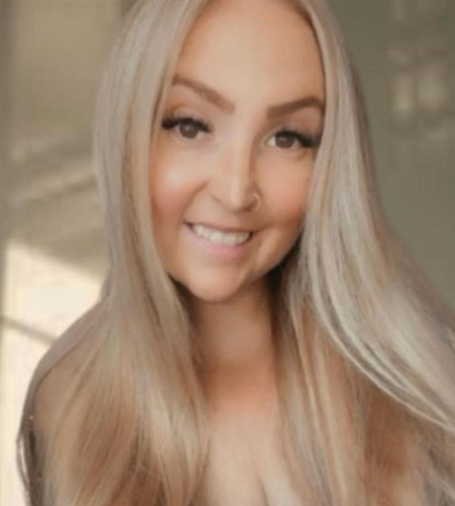 Stevie has long blonde hair and is smiling